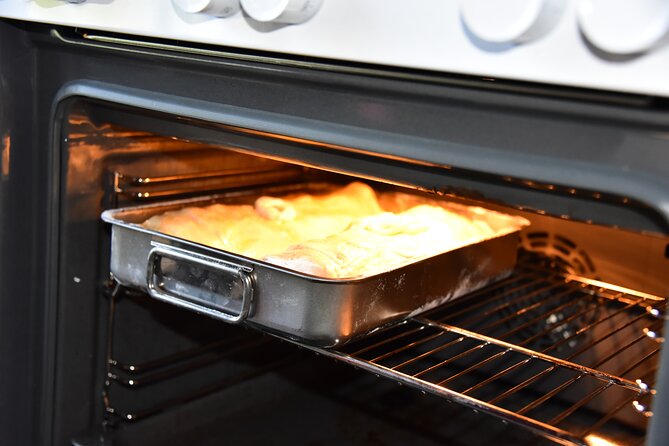 Austrian Apple Strudel Cooking Class including Lunch in Salzburg - Stretching Strudel Dough in Salzburg