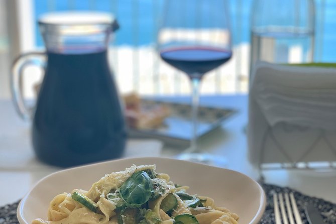 Authentic Cooking with Locals: Meal, Wine & Scenic Views - Sitting down to eat what you made