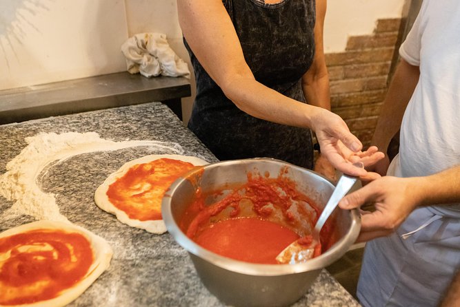 Authentic Pizza Making Class in Naples with Appetizers and Drink - Making pizza at Via delle Zite