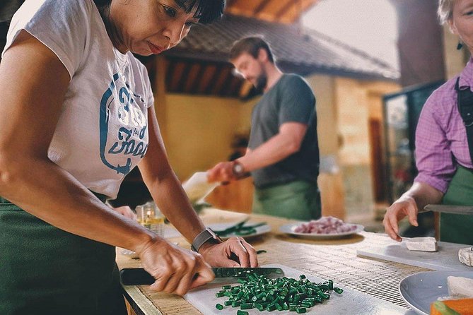 Balinese Cooking class with traditional morning market visit - Making canang before the cooking begins