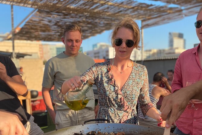 Barcelona Rooftop Paella Cooking Class with Sangria & Local Host - The rooftop setting, with a weather warning