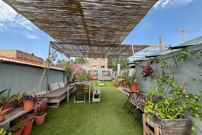 Barcelona Rooftop Paella Cooking Class with Sangria & Local Host - Sitting down to eat what you made