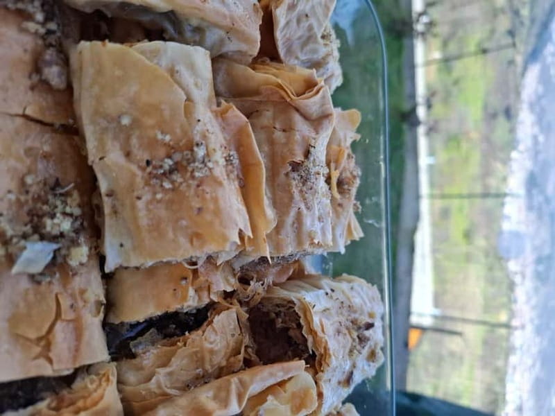 Berat: Farm-to-Table Cooking Class with Local Family - A family table, homemade wine, and local conversation