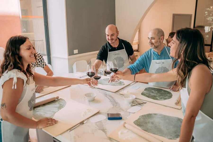 Bologna: Original Lasagna & Gelato Class at a Cooking School - Sitting down to eat your own lasagna