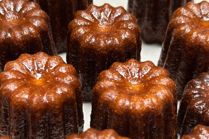 Experience Baking Canele and Madeleine in Bordeaux - Mixing batter and filling traditional copper molds