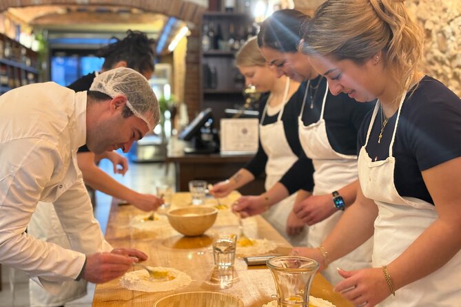 Florence: Pasta & Tiramisu Cooking Class with lots of Good Wine - Mixing pasta dough by hand