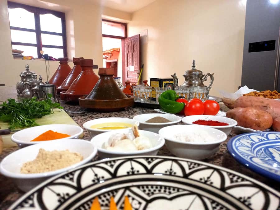 From Marrakech: High Atlas Berber Cooking Class - Eating tagine above the mountain valley