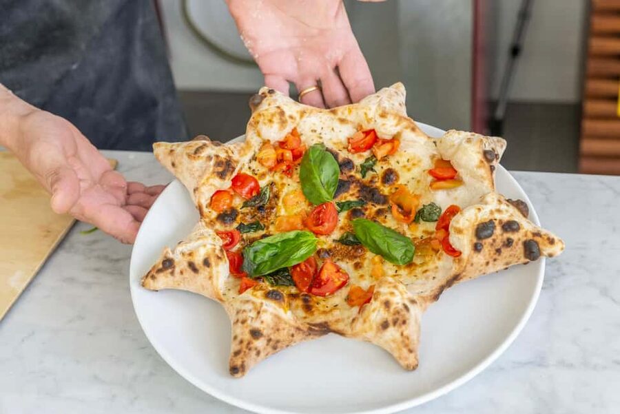 From Sorrento: Pizza-Making Class w/ View of Mount Vesuvius - Stretching the dough and making your pizza