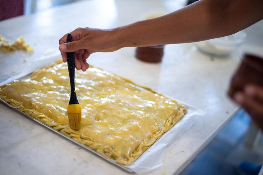 Greek Cooking Class with a Local Chef, Wine, & Meal in Drios - The welcome: wine, souma, and the story behind the food