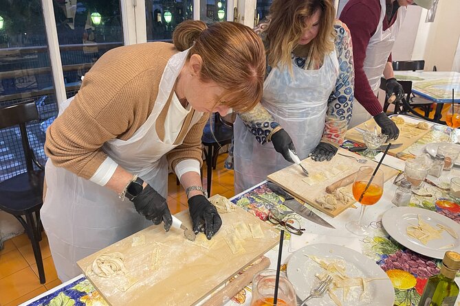 Hands-On Pasta Making and Traditional Tiramisu Workshop - Rolling egg dough with only hands and pins