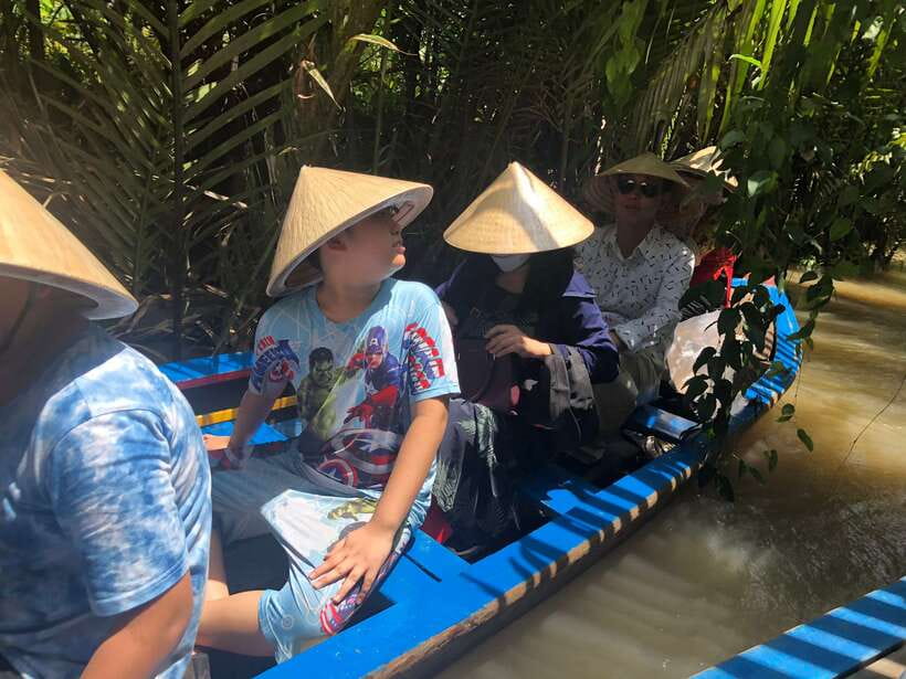 HCM: Mekong Delta Islands Boat & Tuk-Tuk Tour with Tastings - A narrow canal by rowing boat
