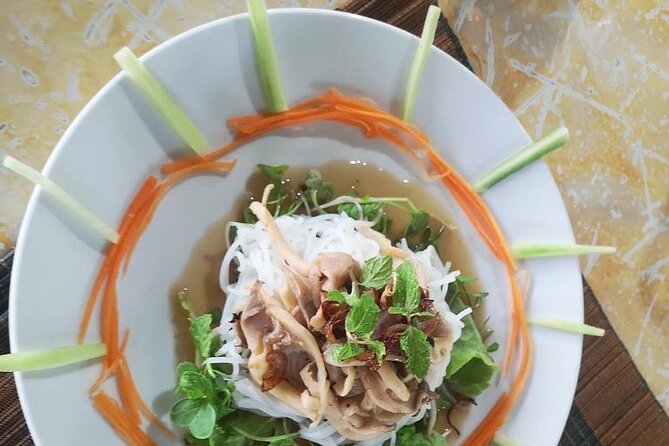 Hoi An Cooking Class with Local Chef - A small group helps at the stove