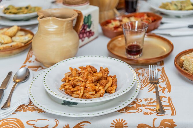 Lucca Walking Tour & Traditional Cooking Class with Wine - From Piazza dell’Anfiteatro to the local shops