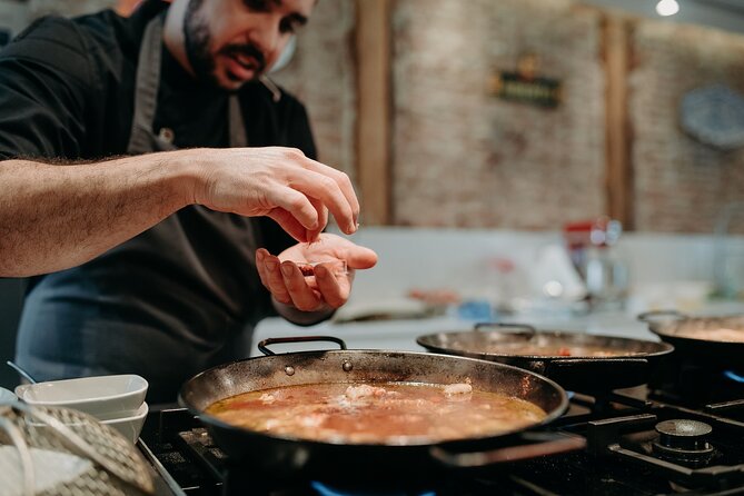 Madrid Tapas & Paella Cooking Experience with Local Market Visit - A shared lunch with plenty on the table