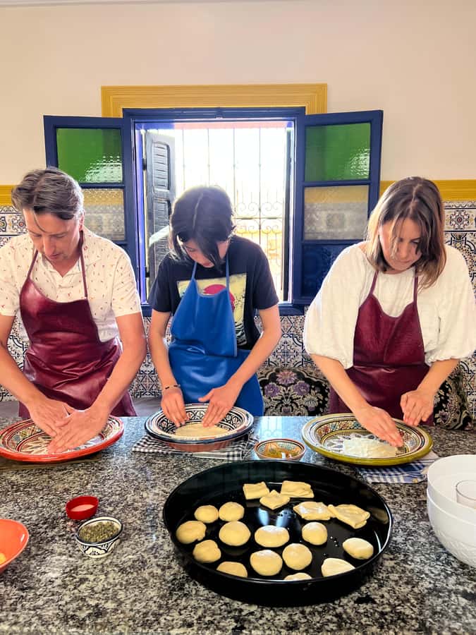 Marrakech: Traditional Moroccan Crepes & Bread Cooking Class - Getting your hands into the dough