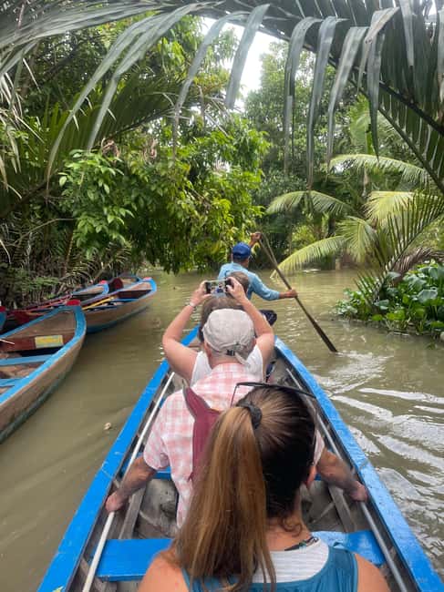 Mekong Delta Day Trip: Explore Cycling & Cook Classes Farm - Folk music, honey tea, and coconut candy
