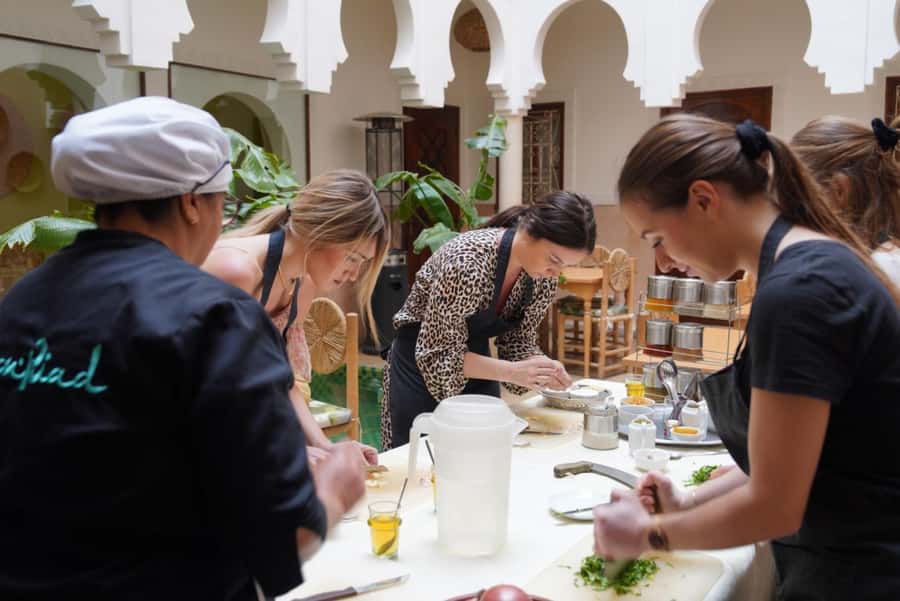 Moroccan cooking class in Marrakech with berber chef - Cooking the meal with Chef Aicha