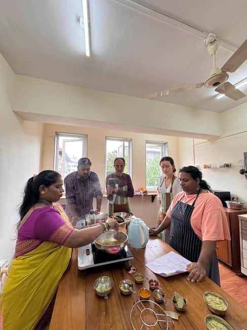 Mumbai: Indian Cooking Class & Cultural Delights - Sitting down to eat your own thali