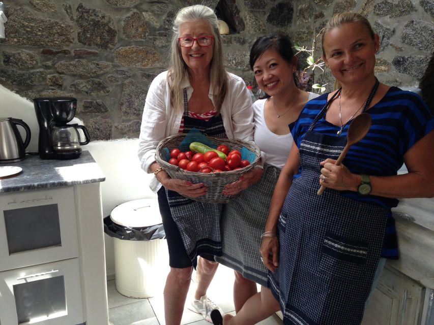 Mykonos: Cooking Class with Food and Wine - The welcome table: dakos, louza, wine, and raki