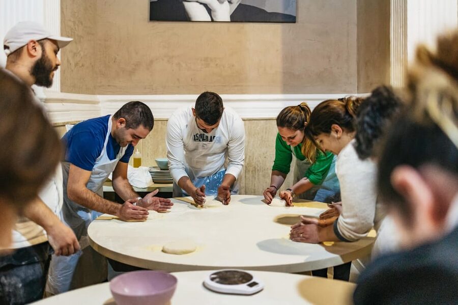 Naples: Pizza-Making Workshop with Drink and Appetizer - The instructors shape the mood