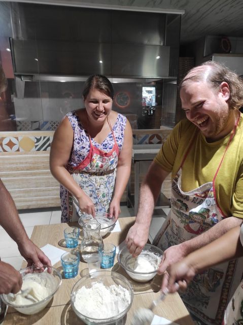 Naples: Small Group Pizza Making with Drink Included - Watching Pietro bake the finished pizza