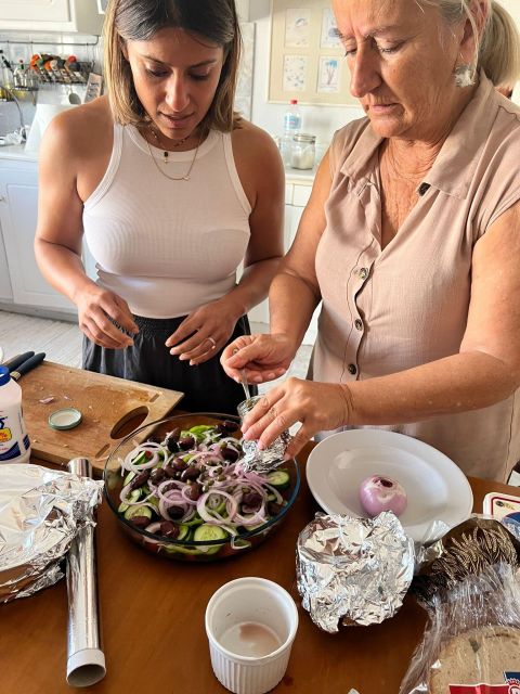 Oia: Greek Cooking Class and Lunch with a Local Grandmother - Meeting Areti outside Karma Restaurant
