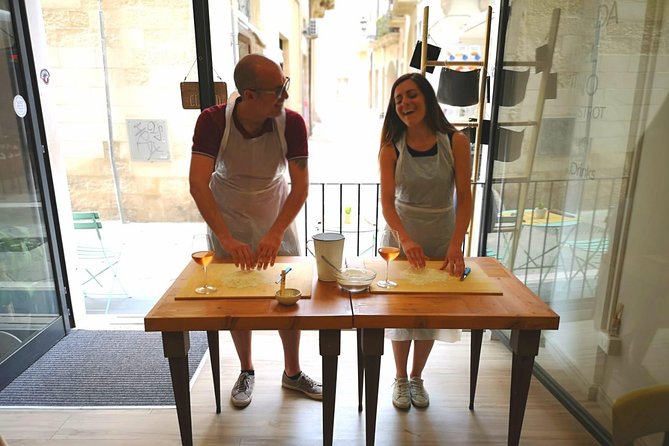 Orecchiette Cooking Class and Wine Pairing in Lecce - Rolling dough into Puglian orecchiette