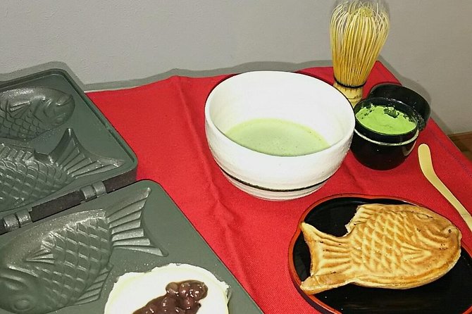 Osaka Cooking Class: Okonomiyaki &Japanese cuisines experience - Turning takoyaki in Osaka