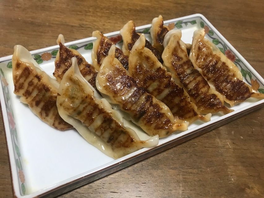 Osaka: Ramen and Gyoza Cooking Class in Dotonbori - Two instructors keep a small class moving