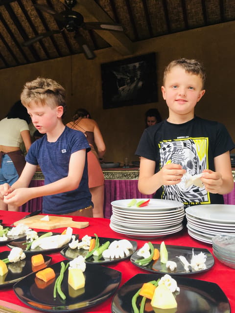 packages cooking class and romantic dinner in a local home - A romantic garden table with candles and petals
