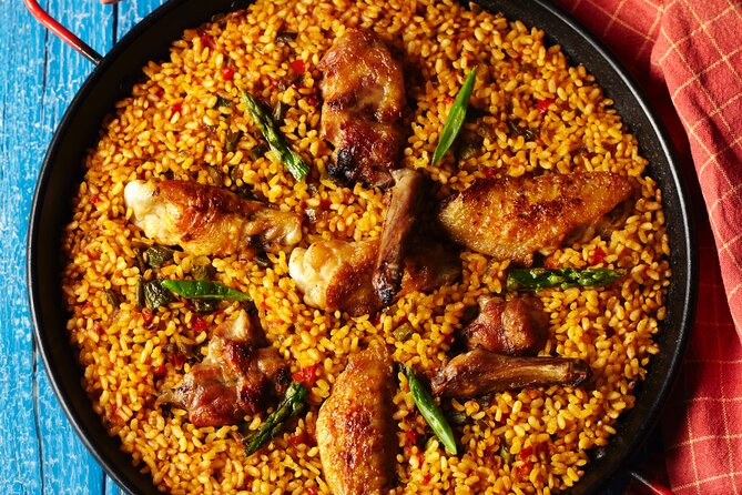 Paella Class & Bottomless Wine: Las Ramblas Views - Cooking paella above Las Ramblas