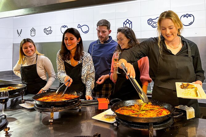 Paella Cooking Class, Wine Tasting & Central Market in Valencia - Sitting down to eat what you made