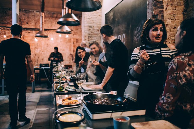 Paella Cooking Class with Professional Chef: Four Course Dinner - Cooking paella in Barcelona’s El Raval