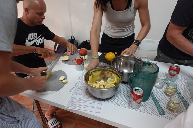 Paella & Sangria Class with Tapas and Market Visit - Walking to a working restaurant kitchen