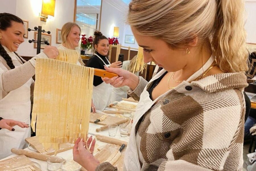 Pasta Cooking Class with Pesto Sauce Making in Rome Center - Sitting down to eat what you made