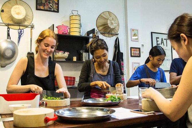 Pink Chili - Thai Cooking Class and Market Tour in Bangkok - Cooking Thai dishes from the wok to the table