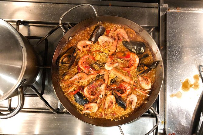 Private Authentic Paella Cooking Class in Barcelona with Josh - Cooking paella in a real Barcelona kitchen
