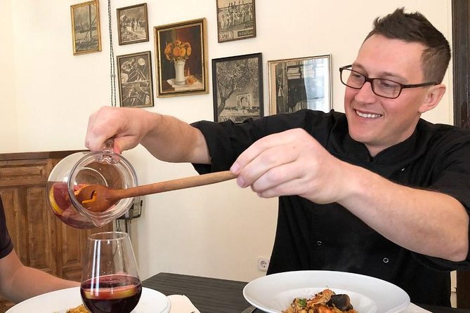 Private Authentic Paella Cooking Class in Barcelona with Josh - Building the paella step by step