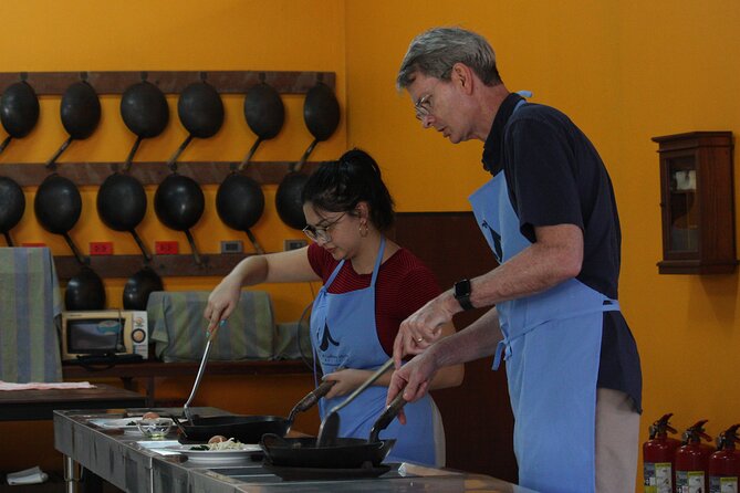 Private Half-Day Thai Cooking Class in Chiang Mai - Cooking with Chef Air in an open-air kitchen