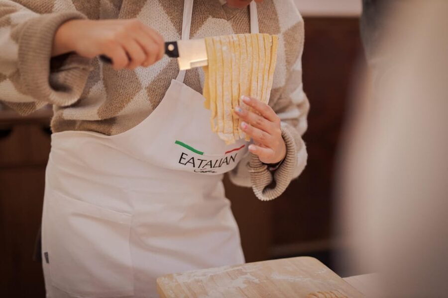 Rome: Fettuccine Pasta Cooking Class in Rome's City Center - Making fettuccine beside Piazza Navona