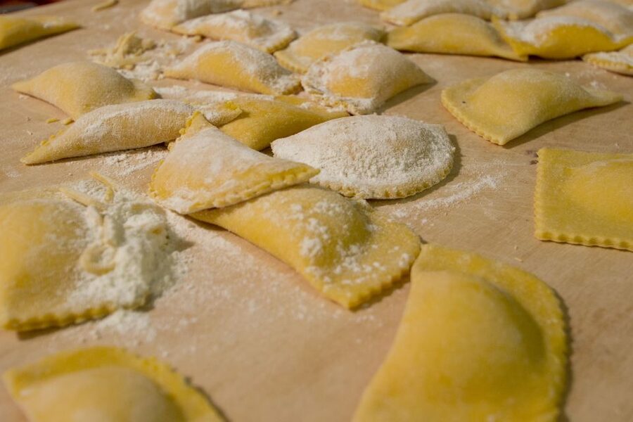 Rome: Fresh Pasta-Making Class with Wine and Gelato - Shaping ravioli and preparing the filling