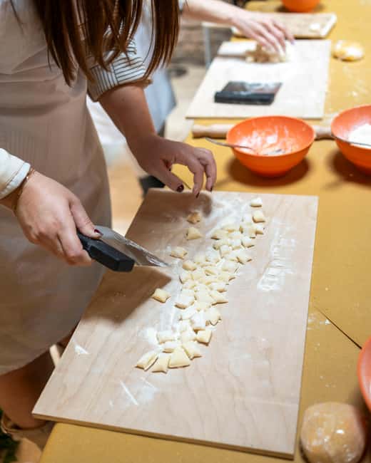 Rome & Milan: Cooking class & wine pairing at Come Na Vorta - Sitting down to eat your own work