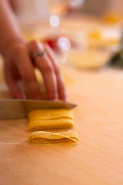 Rome: pasta and tiramisu cooking class in the city center - Sitting down to eat what you made