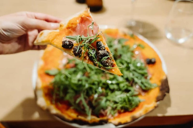 Rome: Pizza Making Class with Gelato & Drinks Included - Stretching, topping, and baking your own pizza