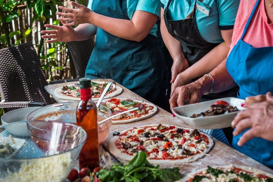 Sorrento: Pizza Making Class at Tirabusciò Cooking School - Choosing toppings and baking your pizza