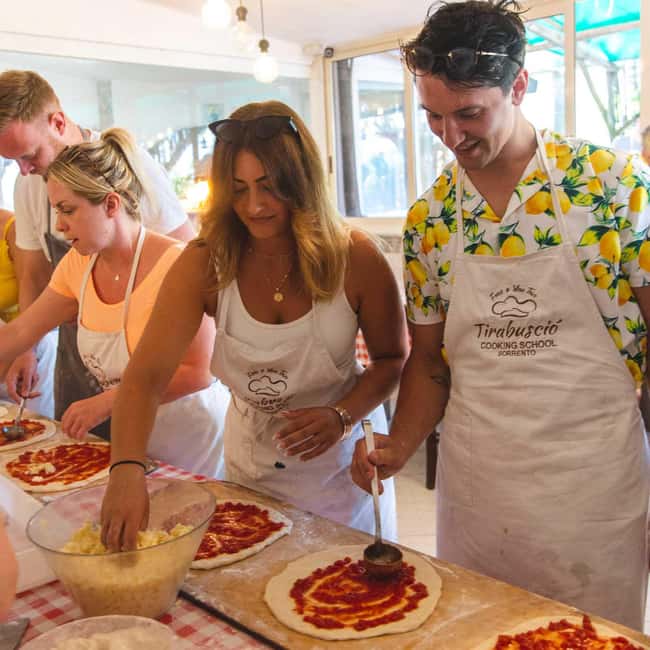 Sorrento: Pizza Making Course - Adding toppings and watching the pizza cook