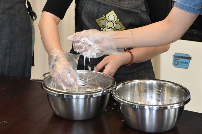 Thai Cooking Class with Market Tour in Sathon Bangkok - Making curry paste the old-fashioned way
