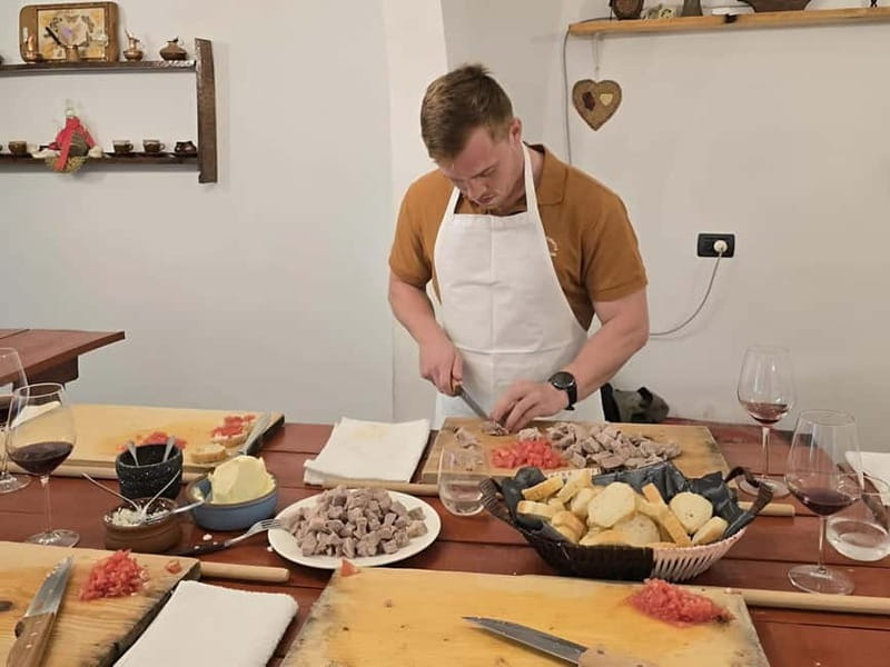 Tirana: Traditional Cooking Class with Wine & Raki Tasting - Cooking tave kosi with a group
