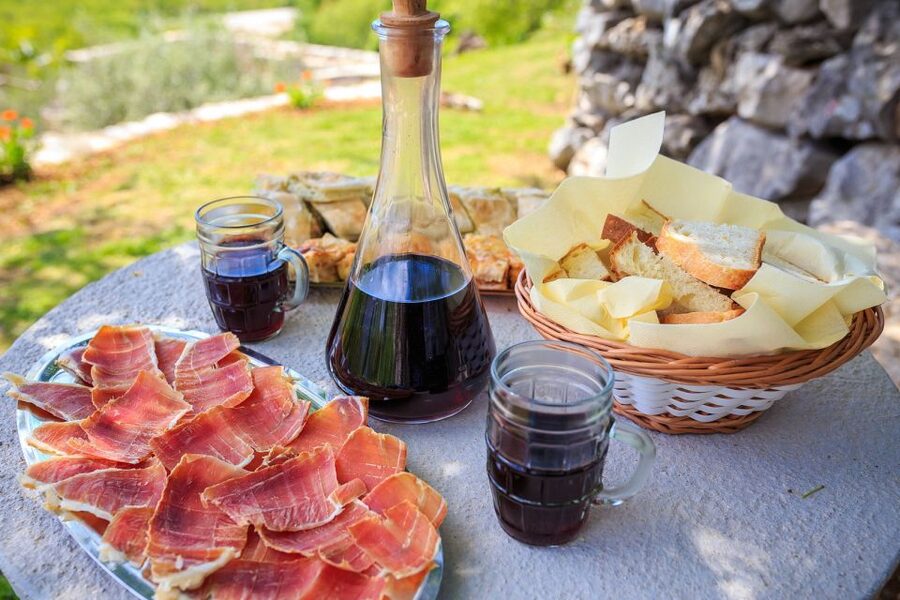 Traditional Dalmatian Cooking Class from Dubrovnik - Sitting down to the meal you helped make