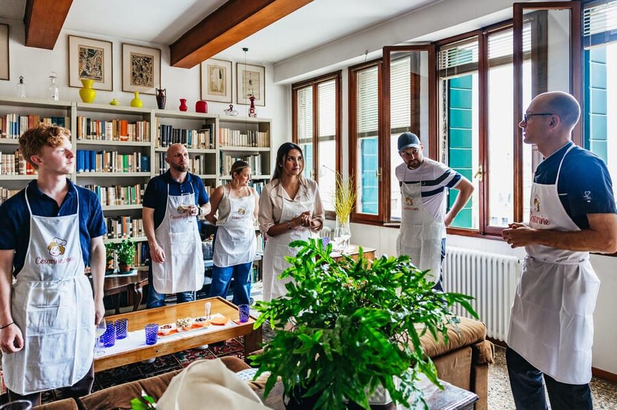 Venice: Pasta and Tiramisu Cooking Class at a Local's Home - Sitting down to eat what you made